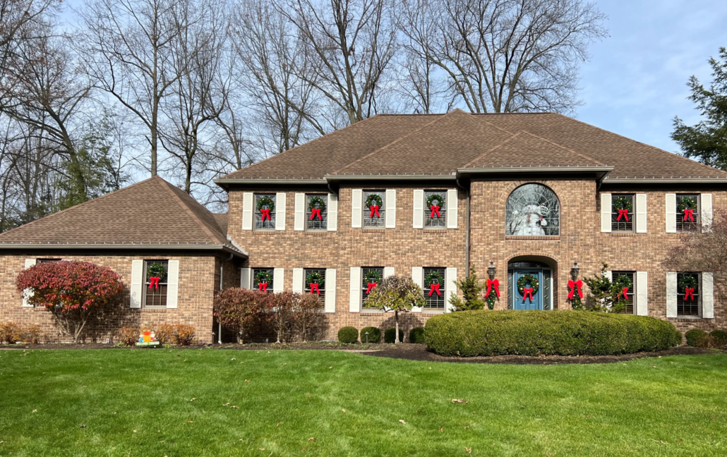 A Poland Ohio House Sits in the Winter Sun with Its Christmas Decorations Up.