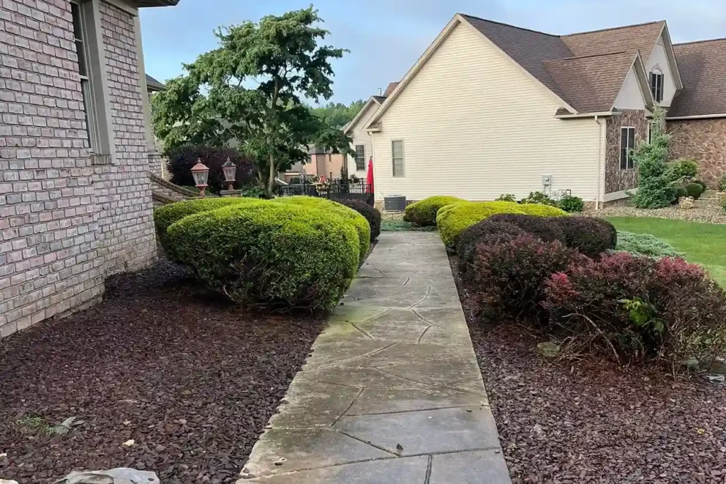 Dirty, Slippery Stamped Concrete Sidewalk in Mahoning Valley Before Being Pressure Washed.