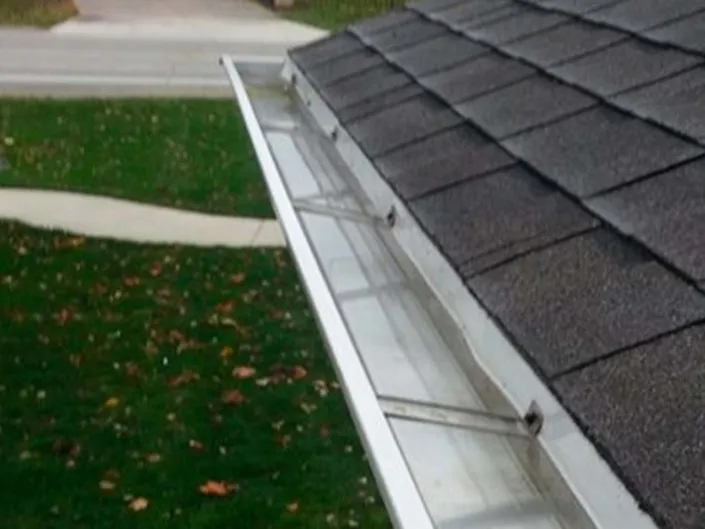 White, Freshly Cleaned Mahoning Valley Gutters on a Suburban Home.
