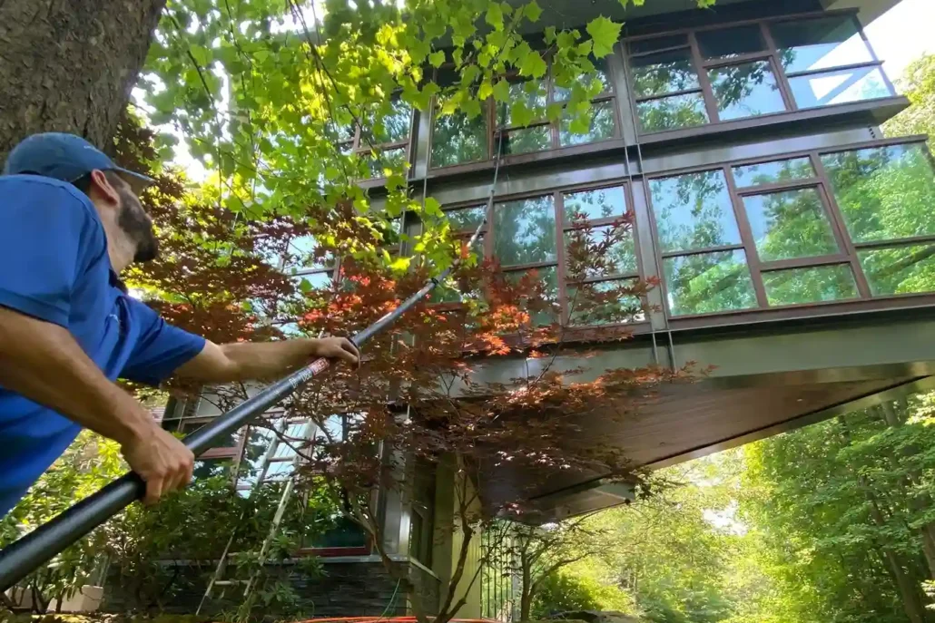 A Window Cleaning Company Cleans the Windows of a Home in Canfield.